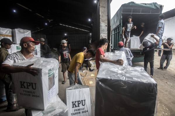 Workers load ballot boxes onto a truck to be distributed to polling stations ahead of Feb. 14 election in Medan, North Sumatra, Indonesia, Monday, Feb. 12, 2024. The world's third-largest democracy is preparing to hold its legislative and presidential elections on Feb. 14, 2024 that will determine who will succeed the incumbent President Joko Widodo, who is serving his second and final term. (AP Photo/Binsar Bakkara)