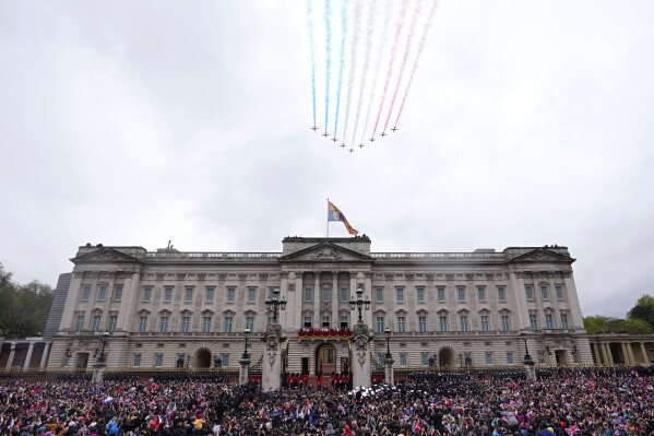 FILE - Britain's King Charles III and Queen Camilla on the balcony of Buckingham Palace watch the Royal Air Force Red Arrows fly over after their coronation ceremony, in London, on May 6, 2023. A change in monarchs, double-digit inflation and ongoing costs of renovating Buckingham Palace contributed to a 5% increase in publicly-funded spending by Britain's royals, royal accounts published Thursday, June 29, 2023 showed. (AP Photo/Petr David Josek, File)