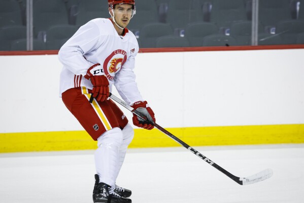 Calgary Flames' Mikael Backlund skates during NHL hockey training camp practice in Calgary, Thursday, Sept. 21, 2023. (Jeff McIntosh/The Canadian Press via AP)