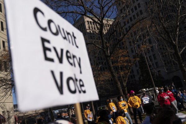 In this Nov. 4, 2020, photo, protestors attend a rally calling for every vote to be counted from the general election near the Detroit Department of Elections building in Detroit.  President-elect Joe Biden shored up the Democrats' “blue wall,” — more sturdily in Michigan, more tenuously in Pennsylvania and Wisconsin — to rebuild the party's path back to the White House. AP Photo/David Goldman)