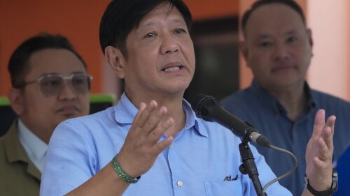 Philippine President Ferdinand Marcos Jr. gestures as he visits an evacuation center at Guinobatan, Albay province, northeastern Philippines, on June 14, 2023. Marcos said Thursday, June 29, that a request for his country to temporarily host a U.S. immigrant visa processing center for thousands of Afghan nationals faces security and other concerns but is still being considered by his administration. (AP Photo/Aaron Favila)