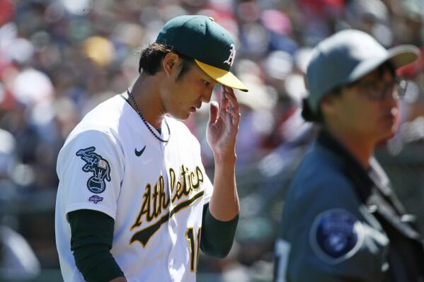 Angels score 11 in 3rd inning, thump Fujinami and A's 13-1