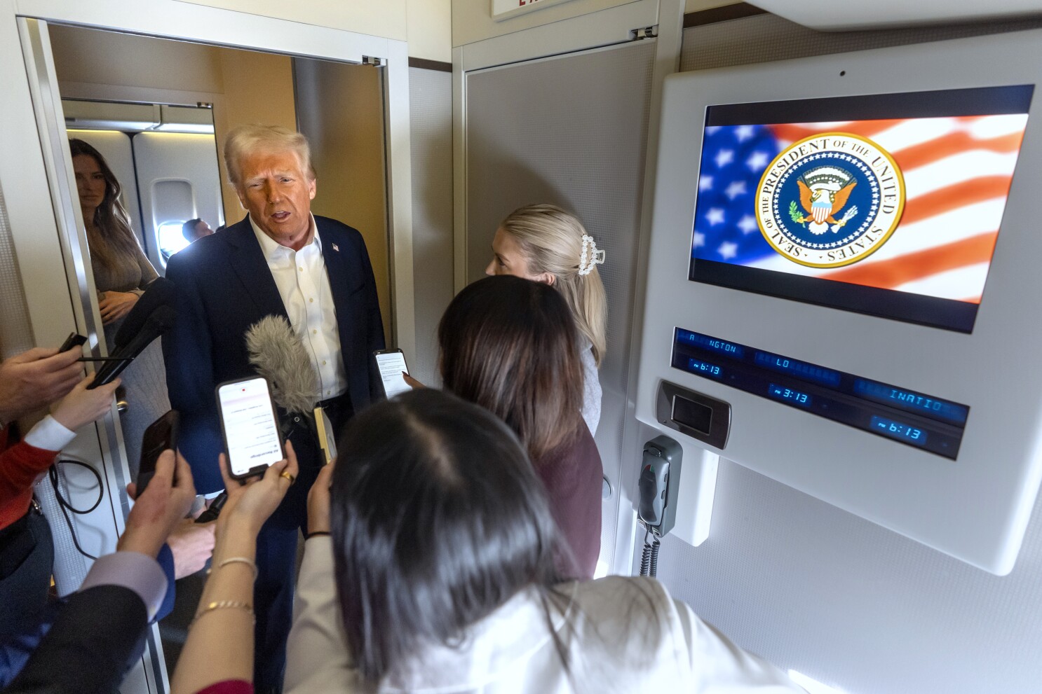 Donald Trump speaking to reporters on Air Force One