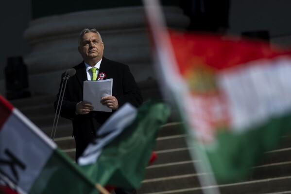 Hungarian Prime Minister Viktor Orban gives a speech on the steps of the National Museum in Budapest, Hungary, on Friday, March 15, 2024. Orban's speech, commemorating the 176th anniversary of Hungary's failed uprising against Habsburg rule, came as his government seeks to mitigate political damage from the resignation of its former president who stepped down in February over a pardon scandal. (AP Photo/Denes Erdos)