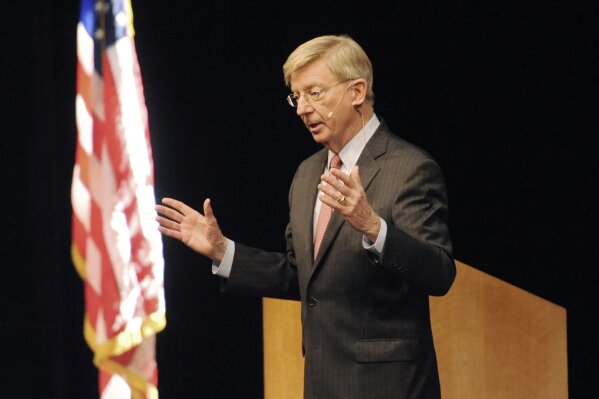 FILE - In this Wednesday, Nov. 4, 2015, file photo, political columnist George Will answers audience questions during a meeting of The Economic Club of Southwestern Michigan at Lake Michigan College, in Benton Township, Mich. Will has been pondering the meaning of the shortest Major League Baseball season since 1878. "If you're an Indians fan and you win the World Series, are you elated or do you think this is just one more insult?" he said. (Don Campbell/The Herald-Palladium via AP, File)