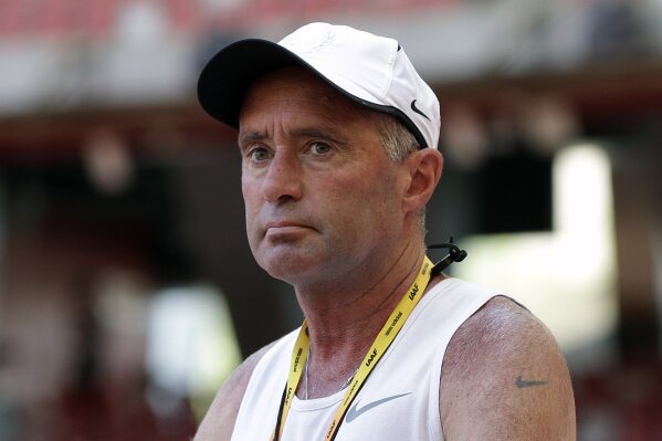 FILE - In this Aug. 21, 2015, file photo, Alberto Salazar watches a training session for the World Athletic Championships at the Bird's Nest stadium in Beijing. Salazar was excited about a performance-enhancing supplement he was trying out on his runners. The supplement ended up triggering a drawn-out investigation that led to Salazar’s four-year suspension from track and field. (AP Photo/Kin Cheung, File)