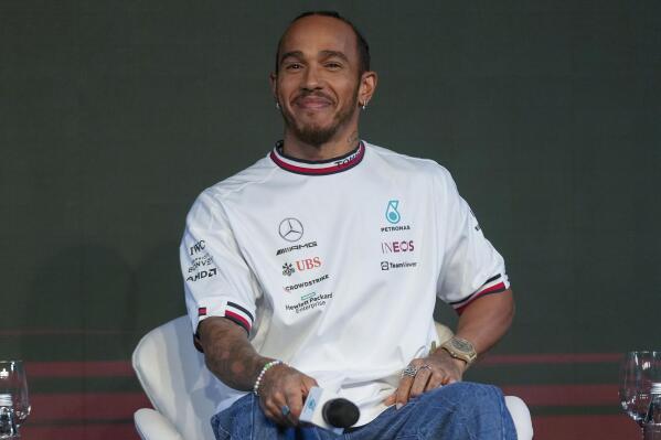 Mercedes driver Lewis Hamilton of Britain smiles during a press conference in Sao Paulo, Brazil, Wednesday, Nov. 9, 2022. Hamilton will compete Sunday in the Brazilian Formula One Grand Prix at Sao Paulo's Interlagos circuit. (AP Photo/Andre Penner)