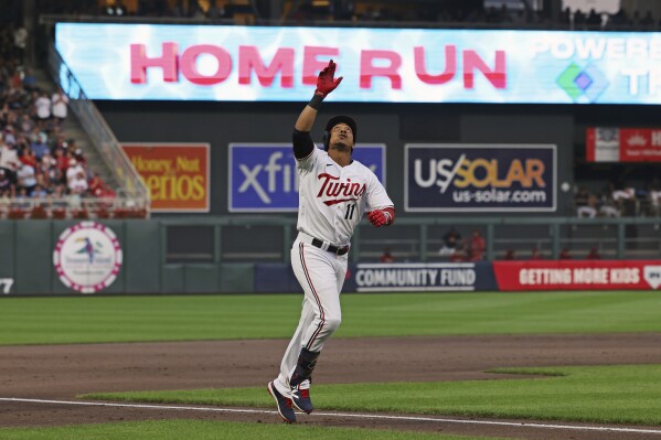 Minnesota Twins' Jorge Polanco heads for home on a home run against the Arizona Diamondbacks during the third inning of a baseball game Friday, Aug. 4, 2023, in Minneapolis. (AP Photo/Stacy Bengs)