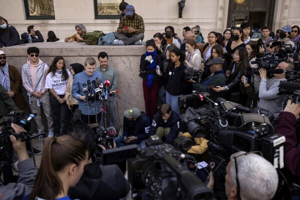 Members of the negotiating team speak during a news conference near a pro-Palestinian protest encampment at Columbia University, Friday, April 26, 2024, in New York.  (AP Photo/Yuki Iwamura)