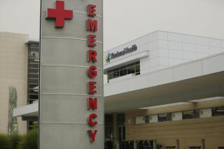 FILE - In this Sept. 10, 2021, file photo, an emergency department sign is photographed at Kootenai Health, in Coeur d'Alene, Idaho. Washington is facing its own COVID-19 crisis and has little capacity to help neighboring Idaho deal with an overwhelming surge of cases driven by unvaccinated people, state hospital executives and doctors said Monday, Sept. 13, 2021. (AP Photo/Young Kwak,FileS)