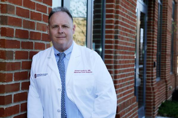 Dr. Michael Cackovic, an OB/GYN who works at Ohio State University’s Wexner Medical Center, stands outside the Ohio State Outpatient Care facility Friday, April 23, 2021, in Upper Arlington, Ohio. When Republican lawmakers across the U.S. kept passing bans on abortion at what they term “the first detectable fetal heartbeat,” he was exasperated. Yet bans pegged to the “fetal heartbeat” concept have been signed into law in 12 states, including Cackovic’s home state of Ohio, with another awaiting a governor’s signature. (AP Photo/Jay LaPrete)