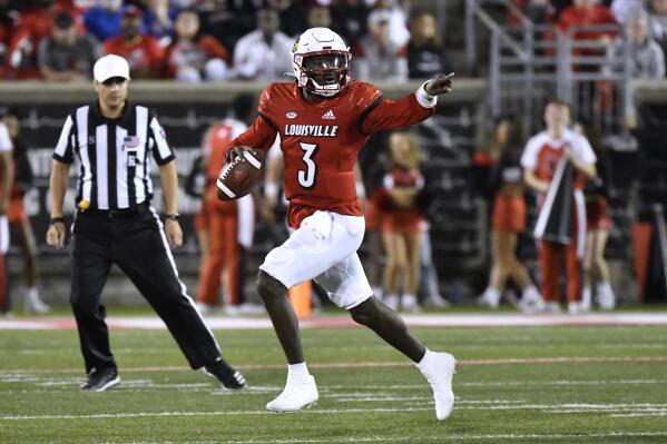 Louisville quarterback Malik Cunningham (3) gestures to receivers as he scrambles during the first half of the team's NCAA college football game against Pittsburgh in Louisville, Ky., Saturday, Oct. 22, 2022. (AP Photo/Timothy D. Easley)