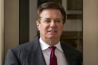 FILE - In this April 4, 2018, file photo, Paul Manafort, President Donald Trump's former campaign chairman, leaves the federal courthouse in Washington. Newly released documents show a Trump campaign official told the FBI that during the 2016 presidential race the campaign's chairman, Manafort, pushed the idea that Ukraine, not Russia, was behind the hack of the Democratic National Committee's servers. (AP Photo/Andrew Harnik, File)