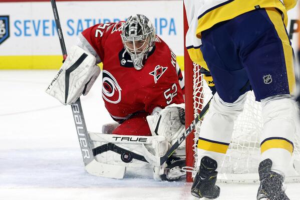 Nashville Predators' Juuse Saros (74) eyes the puck against the Carolina  Hurricanes during the second period of an NHL pre season hockey game in  Raleigh, N.C., Tuesday, Oct. 5, 2021. (AP Photo/Karl