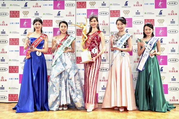 CORRECTS NAME SPELLING: Contestants including Carolina Shiino, who won the Miss Nippon (Japan) Grand Prix, center, pose for a photo after the contest in Tokyo, Monday, Jan. 22, 2024. Crowned Miss Japan this week, Ukrainian-born Carolina Shiino cried with joy, thankful for the recognition of her identity as Japanese. (Miss Nippon Association via AP)