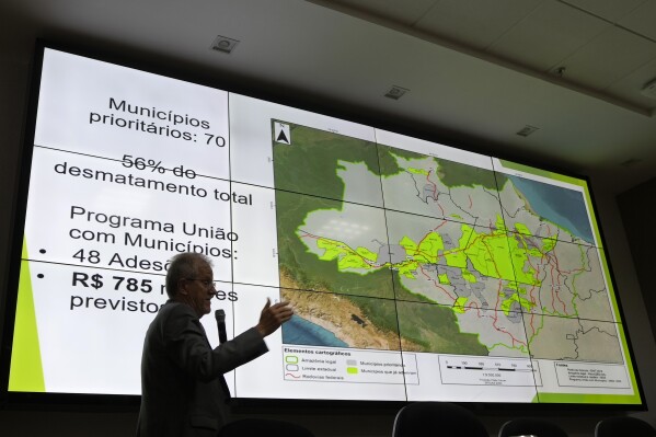 Environment Ministry Executive Secretary Joao Paulo Capobianco presents Amazon and Cerrado deforestation data at the ministry headquarters in Brasilia, Brazil, Wednesday, Aug. 7, 2024. (AP Photo/Eraldo Peres)