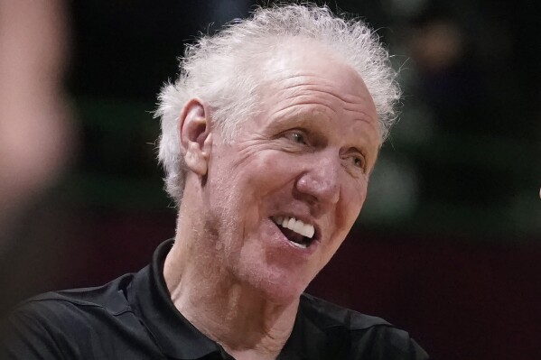 FILE - Basketball Hall of Fame legend Bill Walton laughs during a practice session for the NBA All-Star basketball game in Cleveland, Feb. 19, 2022. Walton, who starred for John Wooden's UCLA Bruins before becoming a Basketball Hall of Famer and one of the biggest stars of basketball broadcasting, died Monday, May 27, 2024, the league announced on behalf of his family. He was 71. (AP Photo/Charles Krupa, File)