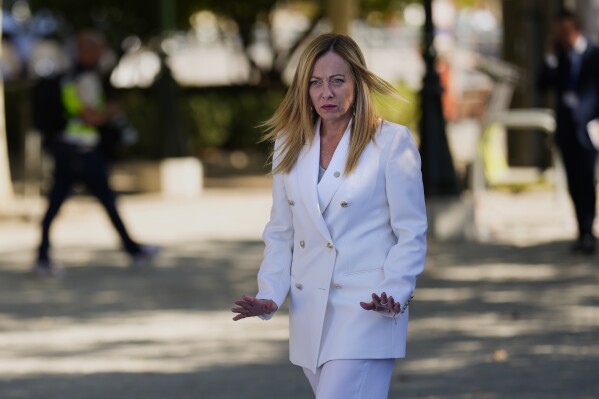 FILE - Italy's Prime Minister Giorgia Meloni arrives at the Europe Summit in Granada, Spain, Thursday, Oct. 5, 2023. Premier Giorgia Meloni’s far-right-led government said authorities in the northeastern border region of Friuli-Venezia Giulia had identified 16,000 people so far this year who had entered Italy illegally. Italy on Wednesday suspended an open-border agreement with neighboring Slovenia citing an increased threat of terrorism in Europe due to Middle East violence. (AP Photo/Manu Fernandez, File)