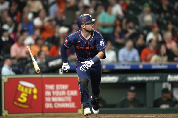 Houston Astros' Alex Bregman tosses his bat after hitting a home run against the Oakland Athletics during the seventh inning of a baseball game Monday, May 13, 2024, in Houston. (AP Photo/David J. Phillip)