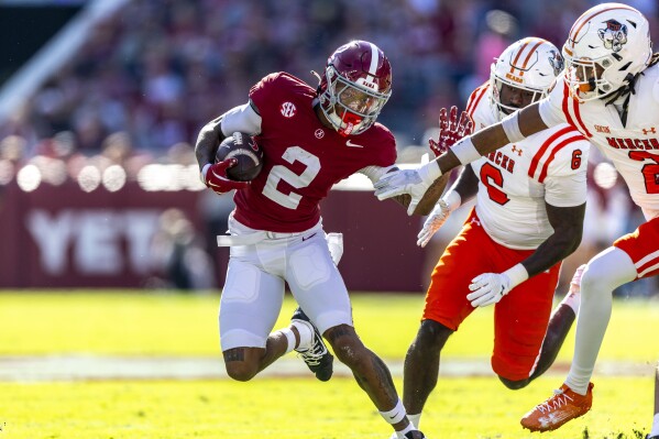 Alabama wide receiver Ryan Williams (2) runs the ball for a touchdown against Mercer during the first half of an NCAA college football game, Saturday, Nov. 16, 2024, in Tuscaloosa, Ala. (AP Photo/Vasha Hunt)