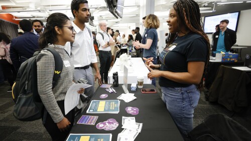 Georgia State University students Kavita Javalagi, left, and Gana Natarajan, second from left, speak with Shetundra Pinkston, during the Startup Student Connection job fair, Wednesday, March 29, 2023, in Atlanta. For the thousands of workers who'd never experienced upheaval in the tech sector, the recent mass layoffs at companies like Google, Microsoft, Amazon and Meta came as a shock. Now they are being courted by long-established employers whose names aren't typically synonymous with tech work, including hotel chains, retailers, investment firms, railroad companies and even the Internal Revenue Service. (AP Photo/Alex Sliz)