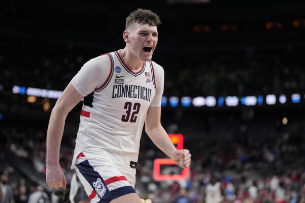 UConn's Donovan Clingan (32) celebrates after the 88-65 win against Arkansas of a Sweet 16 college basketball game in the West Regional of the NCAA Tournament, Thursday, March 23, 2023, in Las Vegas. (AP Photo/John Locher)
