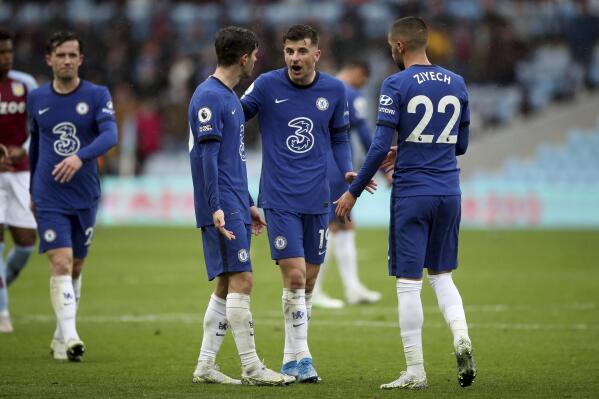 Chelsea's Mason Mount, center, talks with Chelsea's Hakim Ziyech, right, at the end of the English Premier League soccer match between Aston Villa and Chelsea, at Villa Park stadium in Birmingham England, Sunday, May 23, 2021. (Nick Potts, Pool via AP)