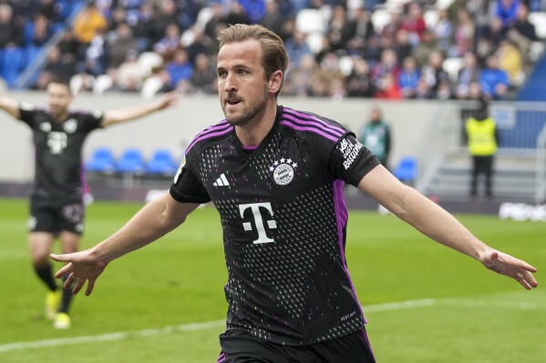 Bayern's Harry Kane celebrates after he scored his side's second goal during a German Bundesliga soccer match between SV Darmstadt 98 and Bayern Munich in Darmstadt, Germany, Saturday, March 16, 2024. (AP Photo/Michael Probst)