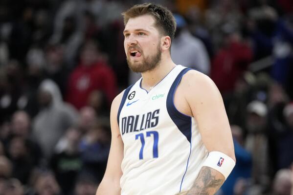 Dallas Mavericks guard Luka Doncic reacts after making a 3-point basket during the second half of an NBA basketball game against the Houston Rockets, Friday, Dec. 23, 2022, in Houston. (AP Photo/Eric Christian Smith)