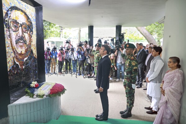 French President Emmanuel Macron pays homage to Bangladesh independence leader Sheikh Mujibur Rahman at the Bangabandhu Memorial Museum in Dhaka, Bangladesh, Monday, Sept.11, 2023. (AP Photo/Yeasin Kabir Joy)