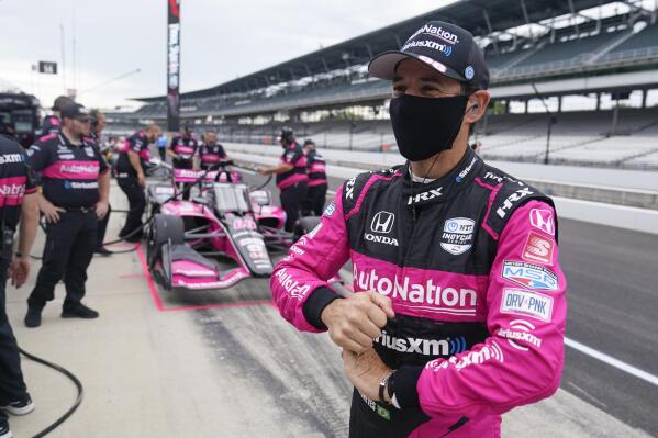 Helio Castroneves, of Brazil, waits in the pits before a practice session for a IndyCar auto race at Indianapolis Motor Speedway, Friday, Aug. 13, 2021, in Indianapolis. (AP Photo/Darron Cummings)