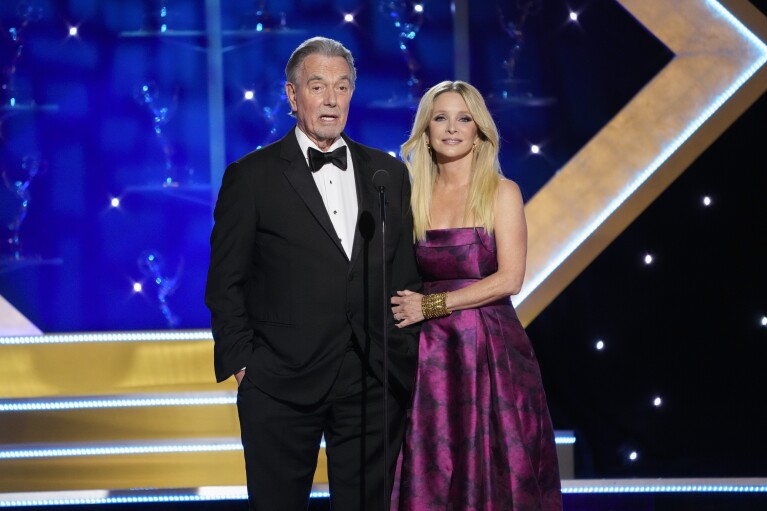 Eric Braeden, left, and Lauralee Bell present the lifetime achievement awards during the 51st Daytime Emmy Awards on Friday, June 7, 2024, at the Westin Bonaventure in Los Angeles. (AP Photo/Chris Pizzello)