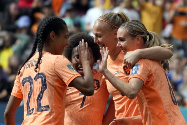 Netherlands' Jill Roord, right celebrates with teammates after scoring her side's first goal during the Women's World Cup round of 16 soccer match between the Netherlands and South Africa at the Sydney Football Stadium in Sydney, Australia, Sunday, Aug. 6, 2023. (AP Photo/Mark Baker)