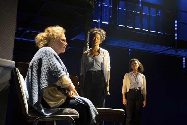 This image released by Boneau/Bryan-Brown shows Maryann Plunkett, from left, Joy Woods and Jordan Tyson during a performance of "The Notebook" in New York, the new musical based on the bestselling novel by Nicholas Sparks that inspired the iconic film. (Julieta Cervantes/Boneau/Bryan-Brown via AP)