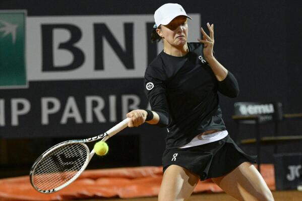 Poland's Iga Swiatek returns the ball to Kazakhstan's Elena Rybakina Open tennis tournament, in Rome, Wednesday, May 17, 2023. (Fabrizio Corradetti/LaPresse via AP)