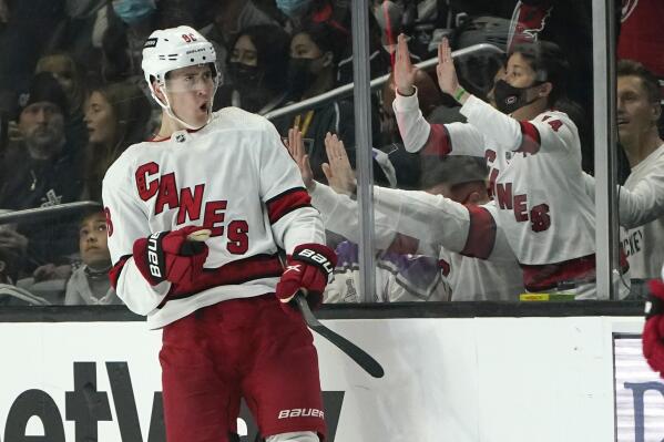 Carolina Hurricanes center Martin Necas celebrates after scoring a goal during the second period of an NHL hockey game against the Los Angeles Kings Saturday, Nov. 20, 2021, in Los Angeles. (AP Photo/Marcio Jose Sanchez)