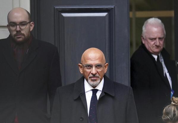 Britain's Conservative Party Chairman Nadhim Zahawi, center, leaves the Conservative Party head office in Westminster, central London, Monday, Jan. 23, 2023. The chairman of Britain’s governing Conservative Party was under pressure to resign on Monday over allegations he settled a multimillion-dollar unpaid tax bill while he was in charge of the country’s Treasury. (James Manning/PA via AP)