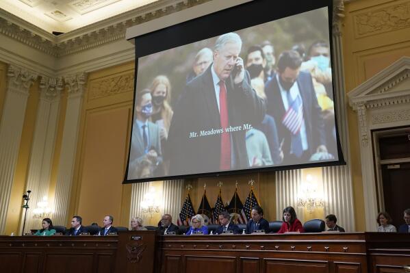 An image of former White House Chief of Staff Mark Meadows is shown as committee members from left to right, Rep. Stephanie Murphy, D-Fla., Rep. Pete Aguilar, D-Calif., Rep. Adam Schiff, D-Calif., Rep. Zoe Lofgren, D-Calif., Chairman Bennie Thompson, D-Miss., Vice Chair Liz Cheney, R-Wyo., Rep. Adam Kinzinger, R-Ill., Rep. Jamie Raskin, D-Md., and Rep. Elaine Luria, D-Va., look on, as the House select committee investigating the Jan. 6 attack on the U.S. Capitol holds its first public hearing to reveal the findings of a year-long investigation, at the Capitol in Washington, Thursday, June 9, 2022. (AP Photo/J. Scott Applewhite)