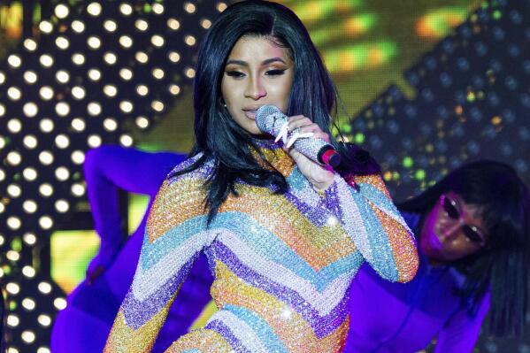 FILE - Cardi B performs at the Bonnaroo Music and Arts Festival in Manchester, Tenn., on June 16, 2019. New York City Mayor Eric Adams announced Wednesday that Cardi B had offered to the financial relief for victims of the Bronx fire. The Grammy-winning artist grew up in the Bronx. (Photo by Amy Harris/Invision/AP, File)
