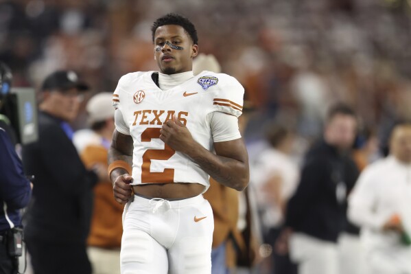 Texas receiving leader Matthew Golden missed big part of Cotton Bowl semi  with apparent foot issue | AP News