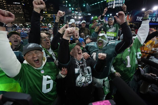 Philadelphia Eagles fans cheer during the first round of the NFL football draft, Thursday, April 25, 2024, in Detroit. (AP Photo/Paul Sancya)