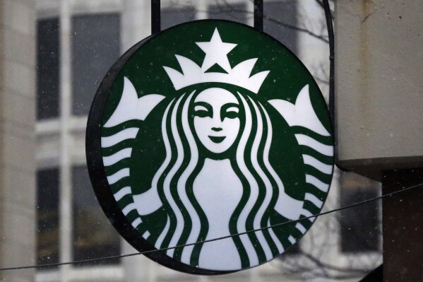 FILE - This Tuesday, March 14, 2017, file photo shows the Starbucks logo on a shop in downtown Pittsburgh. Starbucks reports earnings on Thursday, Nov. 2, 2023. (APPhoto/Gene J. Puskar, File)