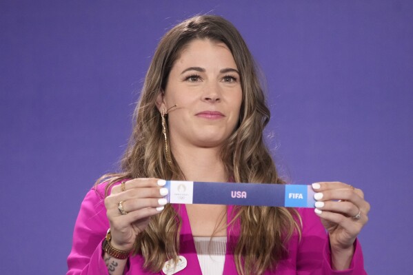 Canadian soccer player Stephanie Labbe draws USA during the draw for the Paris 2024 Olympic Women's Soccer tournaments, Wednesday, March 20, 2024 in Saint-Denis, outside Paris. (AP Photo/Christophe Ena)