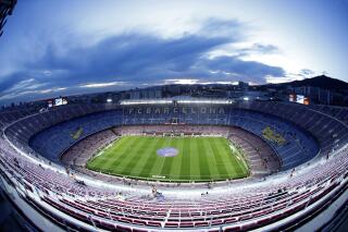 FILE - A general view of the Camp Nou stadium prior of a Spanish Copa del Rey soccer match between Barcelona and Leganes, in Barcelona, Spain, Thursday, Jan. 30, 2020. Barcelona has auctioned off a digital art piece depicting an iconic goal by Johan Cruyff for $693,000 as it seeks new revenues to battle its way out of massive debt. Barcelona says that the auction run by Sotheby’s in New York for the club’s first NFT, or non-fungible token, closed at $550,000. The auctioneer’s fees increased the final sale price to $693,000. (AP Photo/Joan Monfort, File)