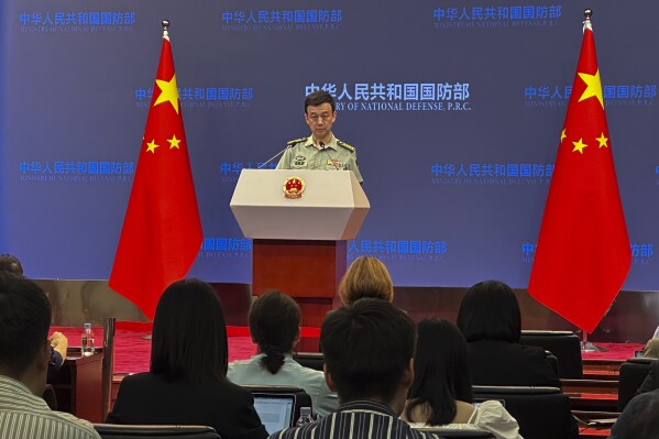 Chinese defense ministry spokesperson Senior Col. Wu Qian speaks during a monthly media briefing in Beijing, Thursday, Sept. 28, 2023. A Chinese Defense Ministry spokesperson said Thursday that he was "not aware of the situation" in the ministry's first public comments on the disappearance of the defense minister from public view about one month ago. (AP Photo/Emily Wang)