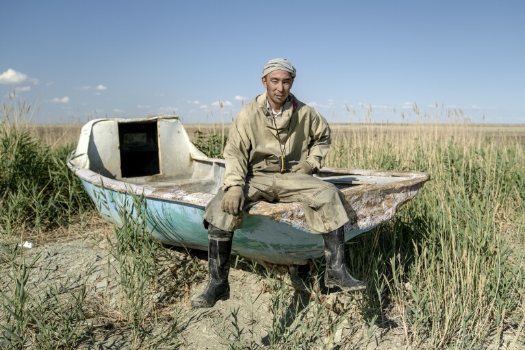 Omirserik Ibragimov, from the village of Tastubek, poses for a photo outside Aralsk, Kazakhstan, Sunday, July 1, 2023. (AP Photo/Ebrahim Noroozi)