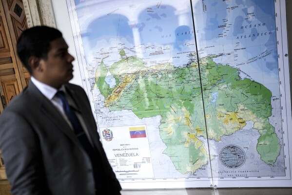 Venezuela's new map that includes the Essequibo territory as its own is displayed at the Foreign Ministry in Caracas, Venezuela, Monday, Dec. 11, 2023. Leaders of Guyana and Venezuela are preparing to meet this week to address an escalating dispute over the Essequibo region that is rich in oil and minerals. (AP Photo/Matias Delacroix)