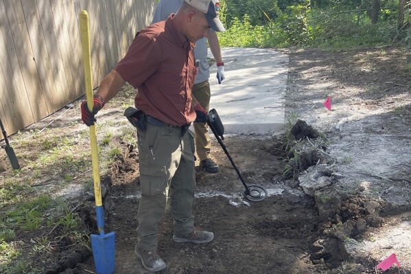 This photo provided by the Osage County, Kan., Sheriff's Office shows the BTK Killer Dennis Rader’s former Kansas property near Park City, Kan., being searched on Tuesday, Aug. 22, 2023, for clues pertaining to two new potential cases. (Eddie Virden/Osage County Sheriff's Office via AP)