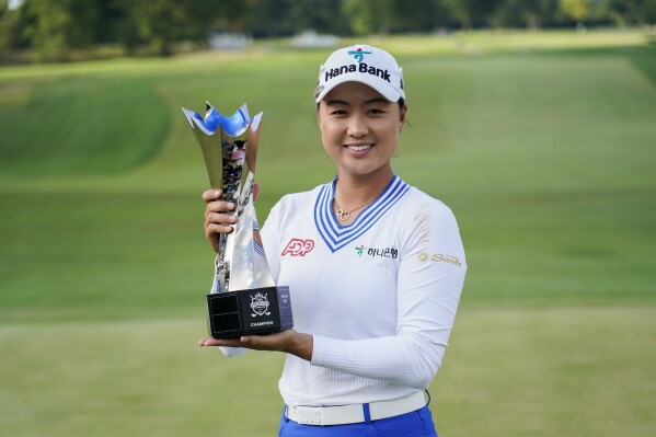 Minjee Lee holds the trophy after winning the LPGA Kroger Queen City Championship golf tournament, Sunday, Sept. 10, 2023, in Cincinnati. Lee finished at -17, defeating Charley Hull after two playoff holes. (AP Photo/Joshua A. Bickel)