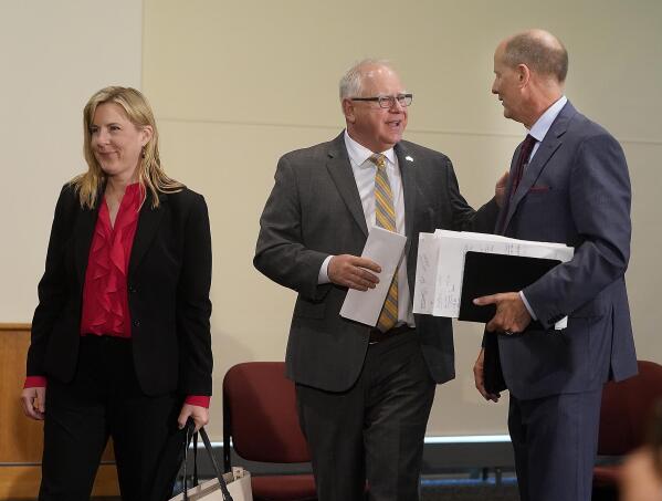 Minnesota Gov. Tim Walz, center, Senate Majority Leader Paul Gazelka, R-East Gull Lake, right, and House Speaker Melissa Hortman, DFL-Brooklyn Park talk after a press conference Monday, May 17, 2021, in St. Paul, Minn., announcing the Legislature and Walz agreed to spend $52 billion on the next two-year budget. (David Joles/Star Tribune via AP)